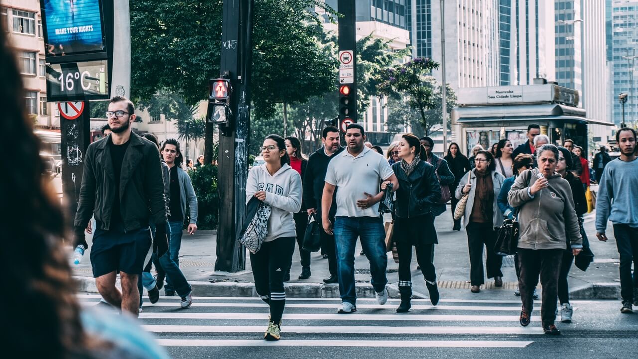 People walking on pedestrian lane during a business daytime