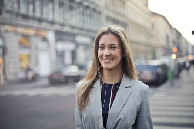 Close-up of businesswoman as she walks down the street