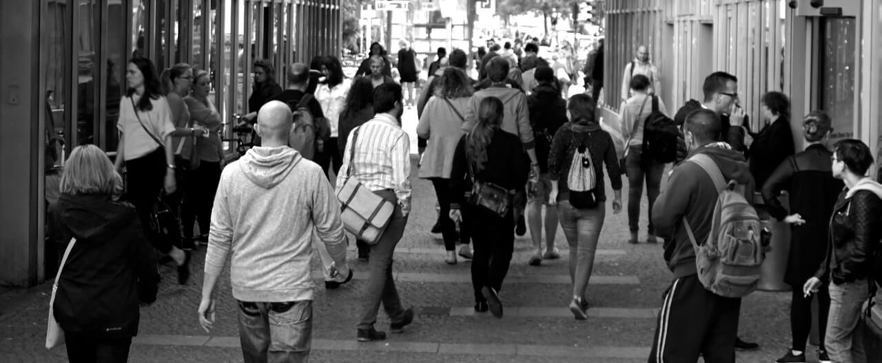 People walking through a city street