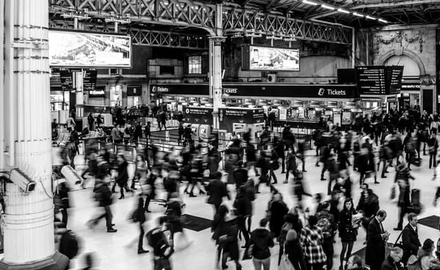 Snapshot of bodies walking through a Victoria station